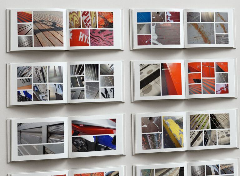 Photography books documenting campus textures and surfaces used for brand backgrounds.