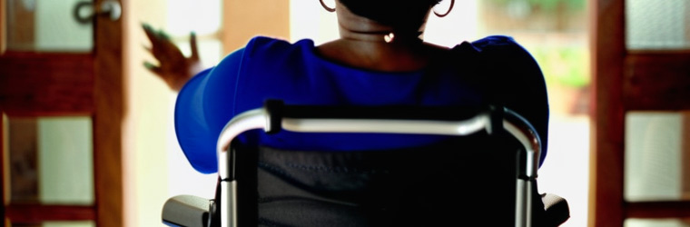 Photo of a woman sitting in a wheelchair